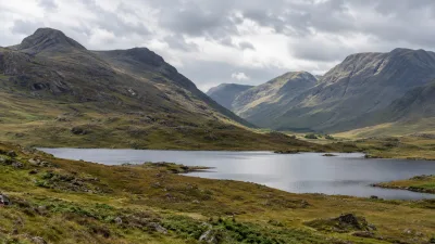 Cloudy Glencoe Mountains by the Loch