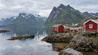 Red Cabins Beneath Lofoten Mountains